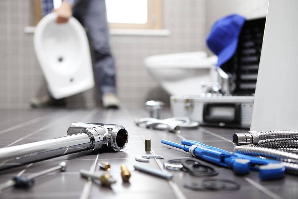 plumber fixing sink